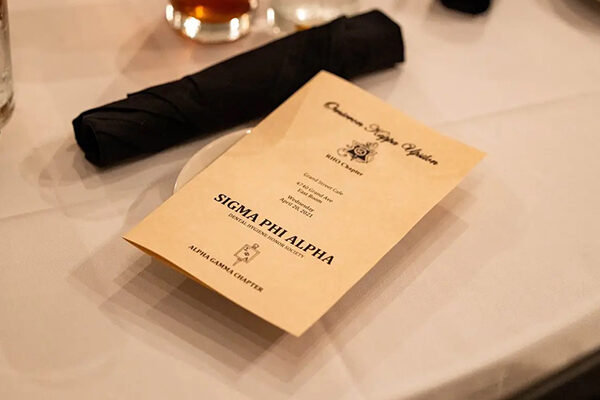 program for Sigma Phi Alpha (Alpha Gamma Chapter) + Omicron Kappa Upsilon (Rho Chapter) banquet at Grand Street Cafe in Kansas City, Missouri on April 20, 2021