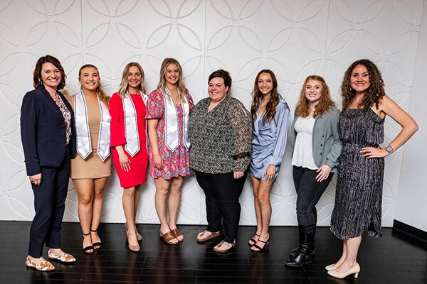 group photo at Sigma Phi Alpha (Alpha Gamma Chapter) + Omicron Kappa Upsilon (Rho Chapter) banquet at Grand Street Cafe in Kansas City, Missouri on April 20, 2021